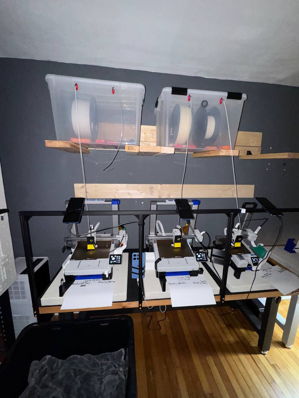 A1 Mini production line — 3 printers on auto-loop with overhead filament storage